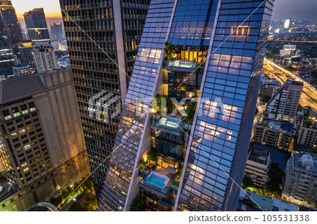 Aerial view of Ploenchit road by night in Bangkok Downtown, financial district and business center Aerial view of Ploenchit road by night in Bangkok Downtown, financial district and business center 105531338