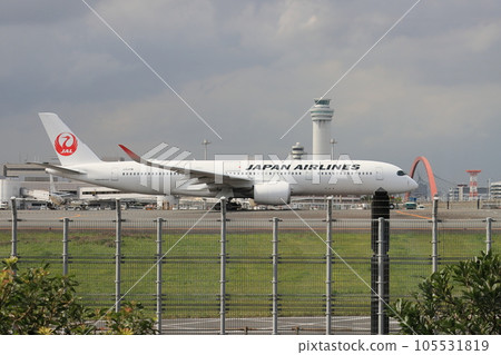 A passenger plane moving through the airport Passenger plane heading for the runway 105531819
