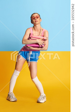 Collage with combination portraits of young beautiful girl with pink glasses and books wearing sportswear and elegant dress over blue and yellow background 105532942