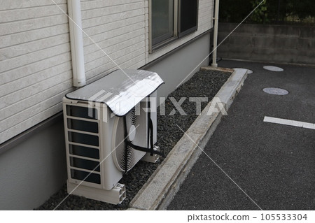 Heat shielding sheet attached to the outdoor unit of an air conditioner 105533304