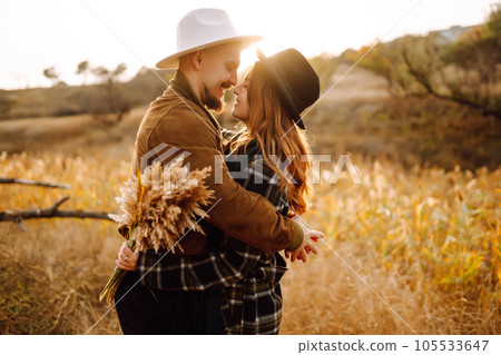 Lovely hipster couple resting in nature. People, lifestyle, relaxation and vacations concept. Lovely hipster couple resting in nature. People, lifestyle, relaxation and vacations concept. 105533647