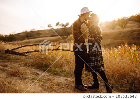 Lovely hipster couple enjoying each other in the autumn park. Nice autumn day. love and lifestyle. 105533648