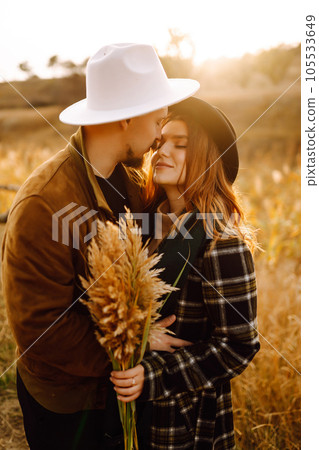 Lovely hipster couple enjoying each other in the autumn park. Nice autumn day. love and lifestyle. 105533649