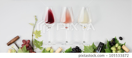 Banner. Flat-lay of red, rose and white wine in glasses on white background 105533872