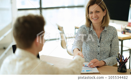 Welcome and accepted handshake gesture in office Welcome and accepted handshake gesture in office 105534482