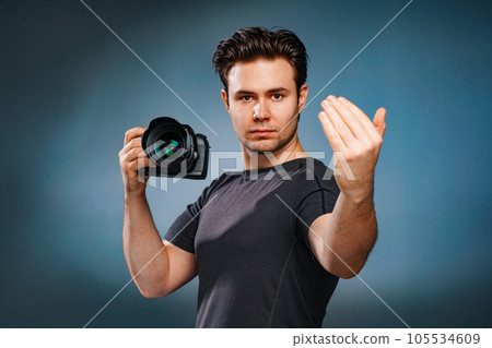Young man with camera Young man with camera 105534609