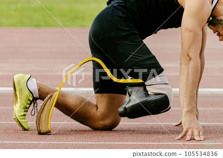 athlete disability runner starting position in running sprint race, sports summer games athlete disability runner starting position in running sprint race, sports summer games 105534836