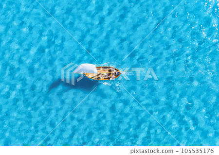 Wave and sail yacht on the sea as a background. .Sea and waves from top view.  105535176