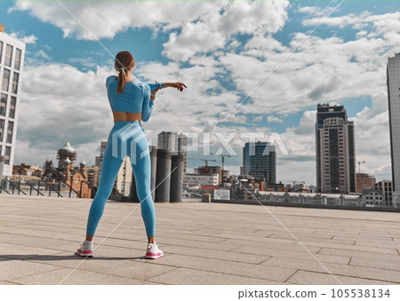 Beautiful fit young woman jogger is running outdoors 105538134