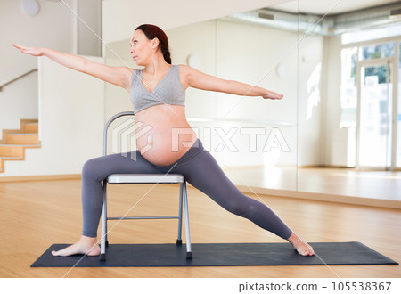 Pregnant woman is engaged in yoga Pregnant woman is engaged in yoga 105538367