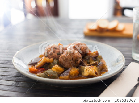 Steamed meatballs with stewed vegetables with haze on plate Steamed meatballs with stewed vegetables with haze on plate 105538368