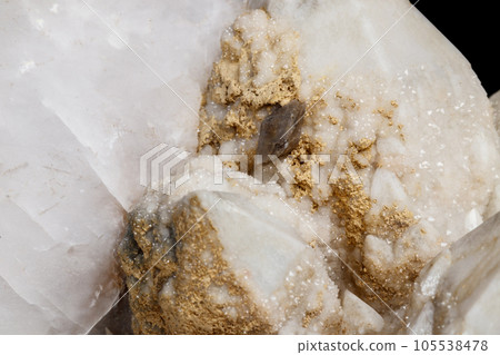 Macro mineral stone Snow quartz with calcite on a black background Macro mineral stone Snow quartz with calcite on a black background 105538478