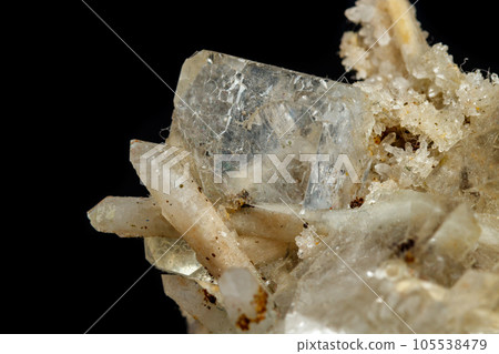 Macro mineral stone fluorite with quartz against black background 105538479
