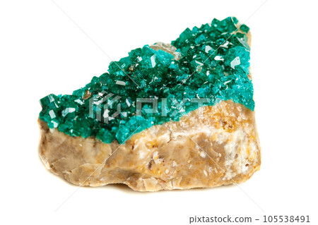 Macro mineral stone Dioptase silicate copper on a white background Macro mineral stone Dioptase silicate copper on a white background 105538491
