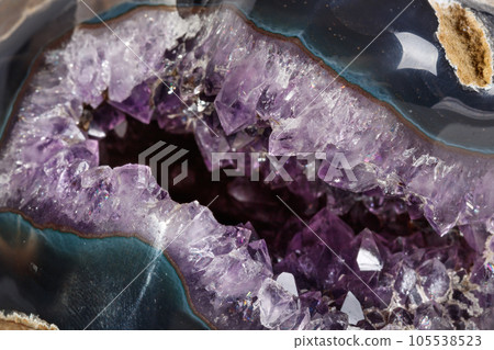 Macro Mineral Stone Amethysts in the rock on a white background 105538523
