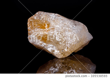 Macro mineral stone Citrine on black background 105538593