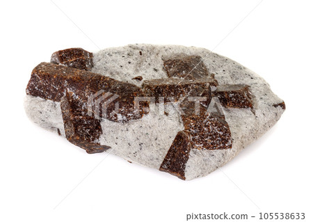 macro mineral stone Staurolite on a white background 105538633