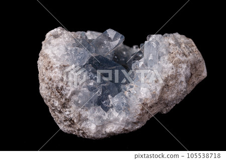 Celestine mineral stone macro on microcline on black background 105538718