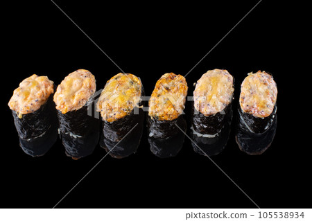 Baked Maki sushi. Hot unagi maki with tobiko. Sushi roll with baked cheese, masago and unagi sauce topped. 105538934