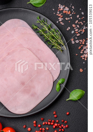 Delicious ham sliced with salt, spices and herbs Delicious ham sliced with salt, spices and herbs 105539013