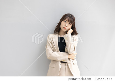Business woman thinking with a serious expression Business woman thinking with a serious expression 105539377