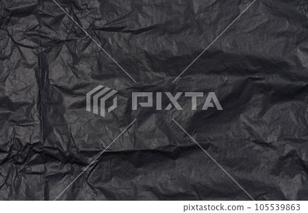 Crumpled sheet of black parchment paper, abstract background 105539863