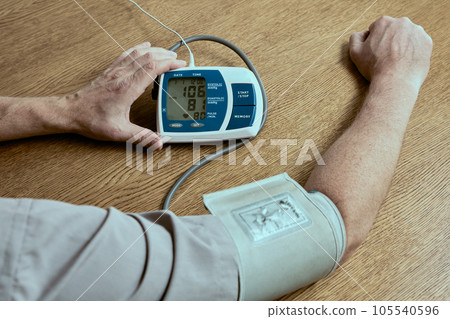 Increased blood pressure on the screen of a blood pressure monitor or sphygmomanometer. 105540596
