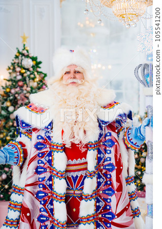 portrait of Father Frost in traditional costume with stick staff. portrait of Father Frost in traditional costume with stick staff. 105541200