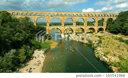 Aerial shot of famous Pont du Gard, the Roman aqueduct bridge of Nimes over the Gardon River. France 105541966