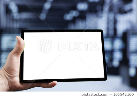 Skilled IT programmer using mock up tablet to check operational server clusters, close up. Mainframes in computer network security data center providing processing resources for several workloads 105542100