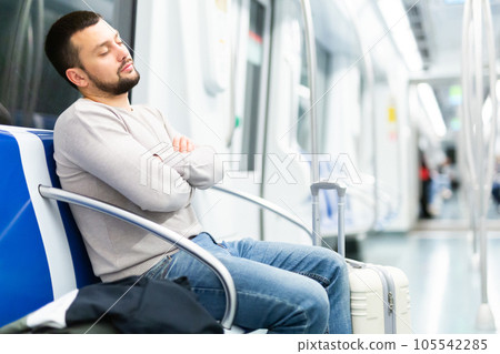 Passenger fell asleep sitting in an empty subway car Passenger fell asleep sitting in an empty subway car 105542285