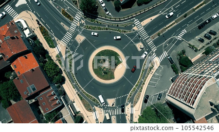 Aerial top down view of a three road roundabout traffic on Montelimar, France Aerial top down view of a three road roundabout traffic on Montelimar, France 105542546