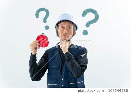 Craftsman holding a wallet and thinking Craftsman holding a wallet and thinking 105544286