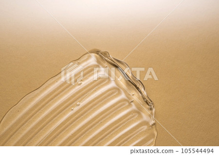 Transparent hyaluronic gel on a beige background. 105544494