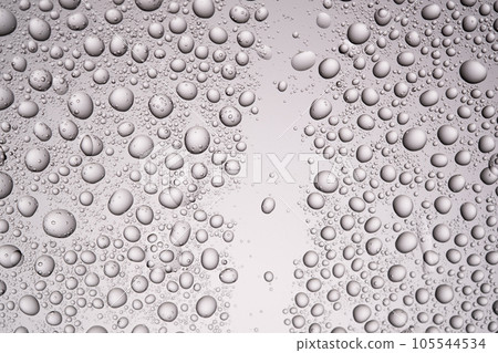 Drops of water on a transparent gray background. Drops of water on a transparent gray background. 105544534