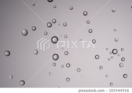 Drops of water on a transparent gray background. Drops of water on a transparent gray background. 105544558