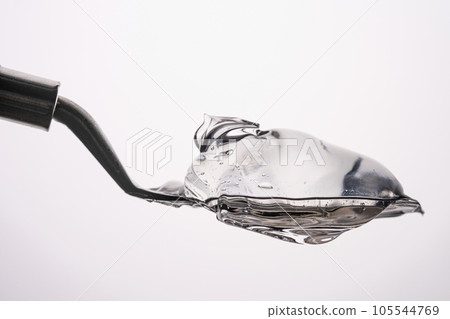 The texture of a thick cosmetic gel on a neutral background. 105544769