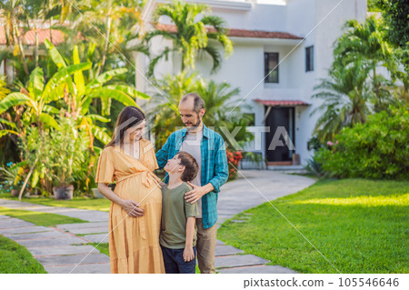 A heartwarming photo depicting a family after 40, with a pregnant mom, dad, and their teenage son, celebrating their new milestone of buying a house together A heartwarming photo depicting a family after 40, with a pregnant mom, dad, and their teenage son, celebrating their new milestone of buying a house together 105546646
