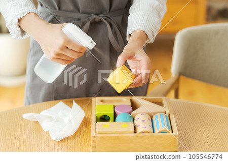 Hand photo of a woman who disinfects toys Hand photo of a woman who disinfects toys 105546774