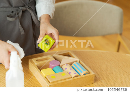Hand photo of a woman who disinfects toys Hand photo of a woman who disinfects toys 105546786
