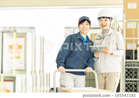 Female driver and worker working in warehouse Female driver and worker working in warehouse 105547193