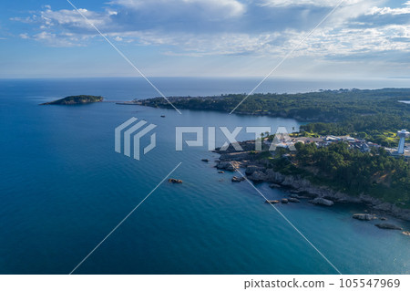 Drone | Aerial view of tourist attractions Tojinbo and Oshima with blue sky in summer and precipitous cliffs from the sea | Sakai City, Fukui Prefecture Drone | Aerial view of tourist attractions Tojinbo and Oshima with blue sky in summer and precipitous cliffs from the sea | Sakai City, Fukui Prefecture 105547969