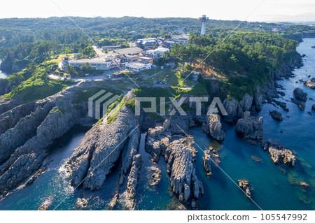 Drone | Aerial view of Tojinbo, a sightseeing spot with steep cliffs wrapped in the summer sun from the sea | Sakai City, Fukui Prefecture Drone | Aerial view of Tojinbo, a sightseeing spot with steep cliffs wrapped in the summer sun from the sea | Sakai City, Fukui Prefecture 105547992