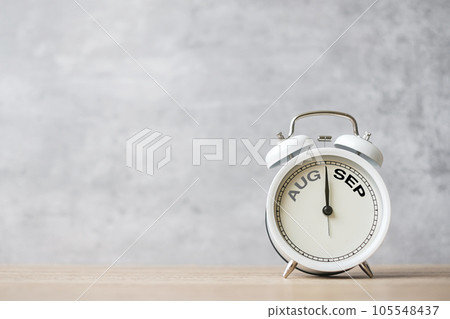 Hello September  Changed from August month with vintage alarm clock on table background. Calendar, Monthly, New Start, Resolution, Goals, Plan, Action and Mission Concept 105548437