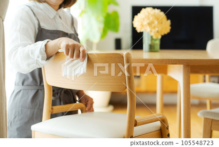 Part cut of mom wiping the chair Part cut of mom wiping the chair 105548723