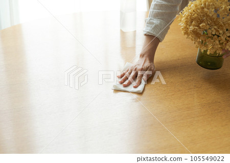 Part cut of a woman wiping the table Part cut of a woman wiping the table 105549022