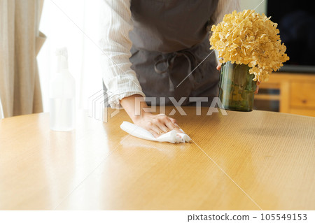 Part cut of a woman wiping the table Part cut of a woman wiping the table 105549153