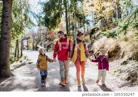 Happy family hiking together in autumn mountains. Happy family hiking together in autumn mountains. 105550247