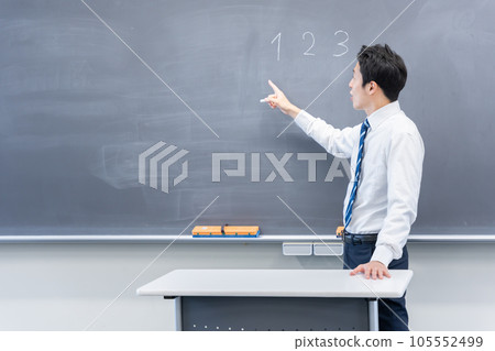 Male teacher teaching in a classroom Male teacher teaching in a classroom 105552499