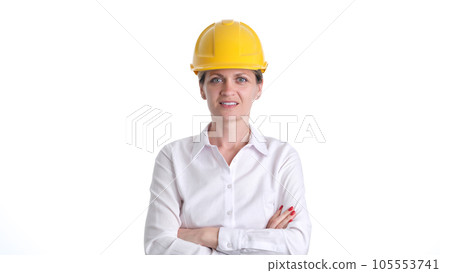Smiling female architect or engineer in safety helmet Smiling female architect or engineer in safety helmet 105553741